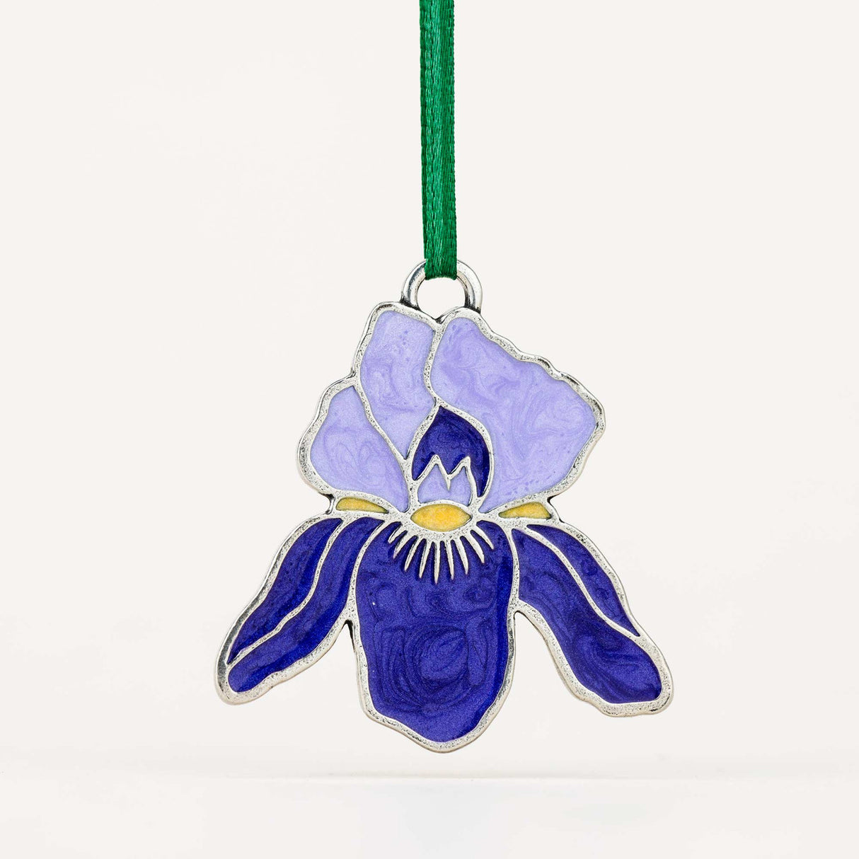 Decorative ornament with a purple and blue flower design on a white background