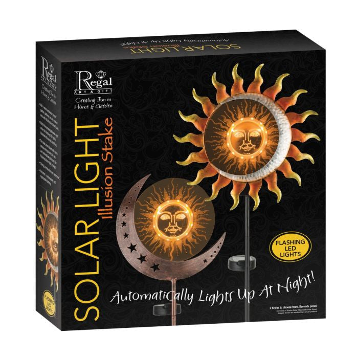 Illuminated solar garden stake with crescent moon and star design at night