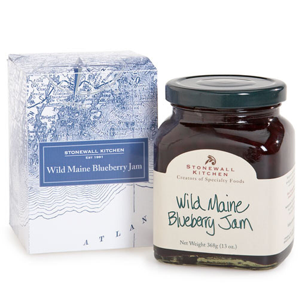 a handsome gift box with nautical map of coastal Maine alongside a jar of wild Maine blueberry jam against a white background