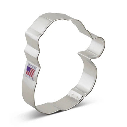 cookie cutter in the shape of Santa Claus' face