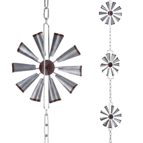 Decorative metal windmill hanging from chains on a white background