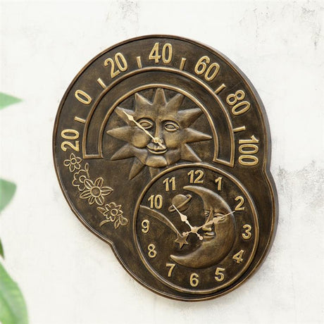 wall mounted sun and moon clock and thermometer with warm whimsical faces
