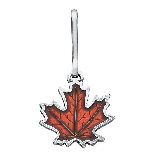 a handcrafted pewter and rust orange colored maple leaf zipper pull on a white background