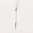 Stylish pewter icicle pendant necklace on an 18-inch sterling silver lariat chain, featuring a subtle, elegant design inspired by vintage Bakelite ornaments against a white background