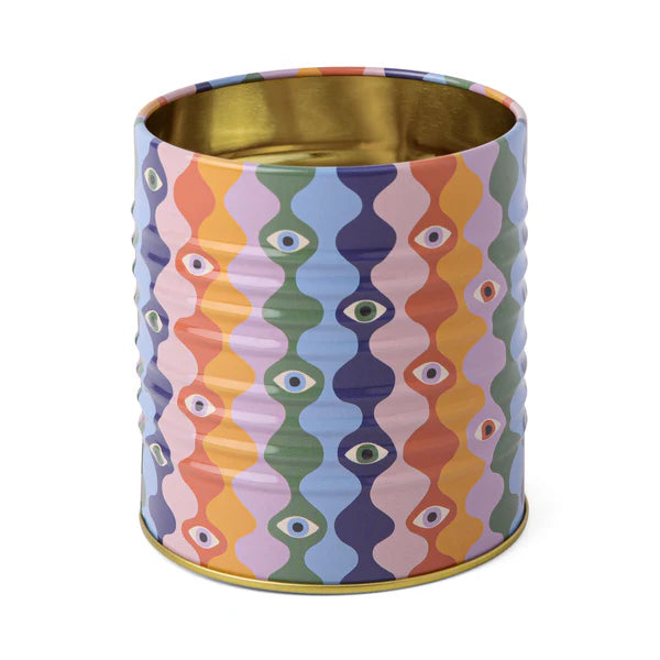 Colorful patterned container with gold interior on a white background