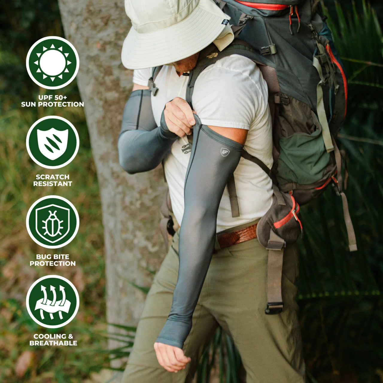 a model in the woods with a sun hat, backpack, and wearing the gray protection sleeves. text around the image reads "UPF 50+ Protection, Scratch Resistant, Bug Bite Protection, and Cooling & Breathable"