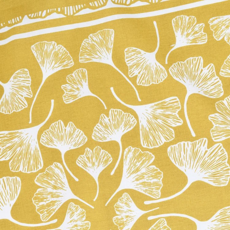 close up of illustration detail of White ginkgo leaf pattern on a mustard yellow bandana