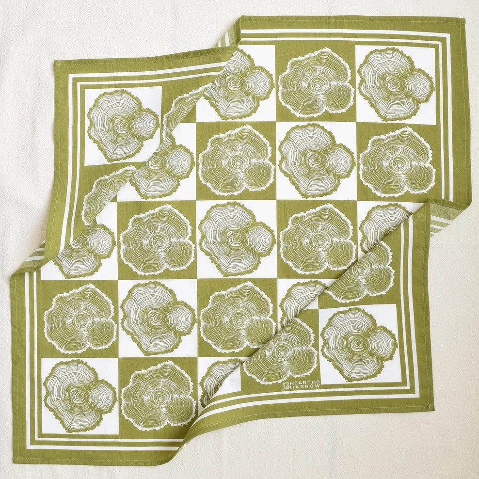 Green and white checkered bandana with tree ring pattern on a white background
