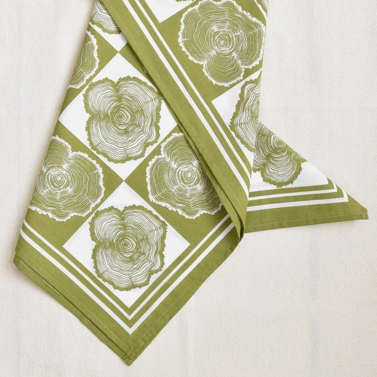 Green and white patterned bandana on a white background