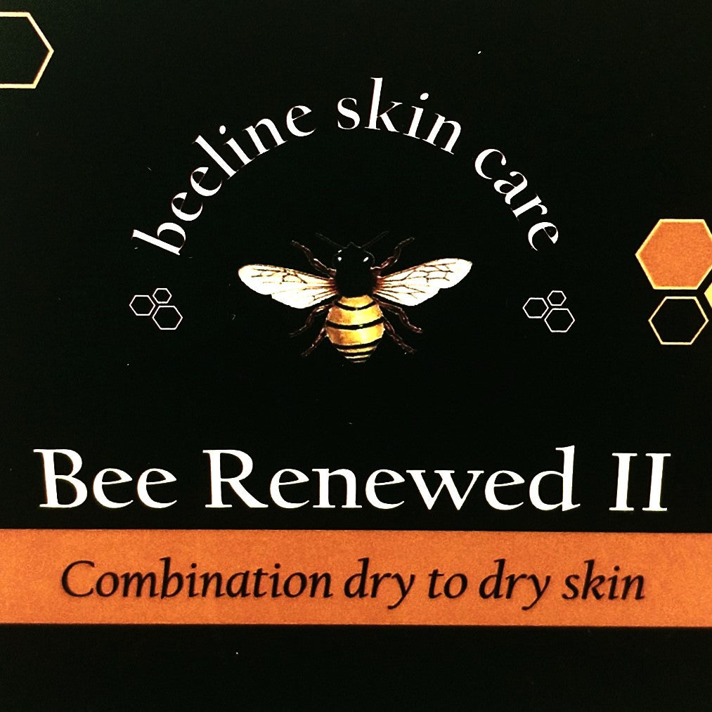 a close up of the Bee Renewed II tag; black tag with Bee illustration and the text "Bee Renewed II: Combination dry to dry skin"