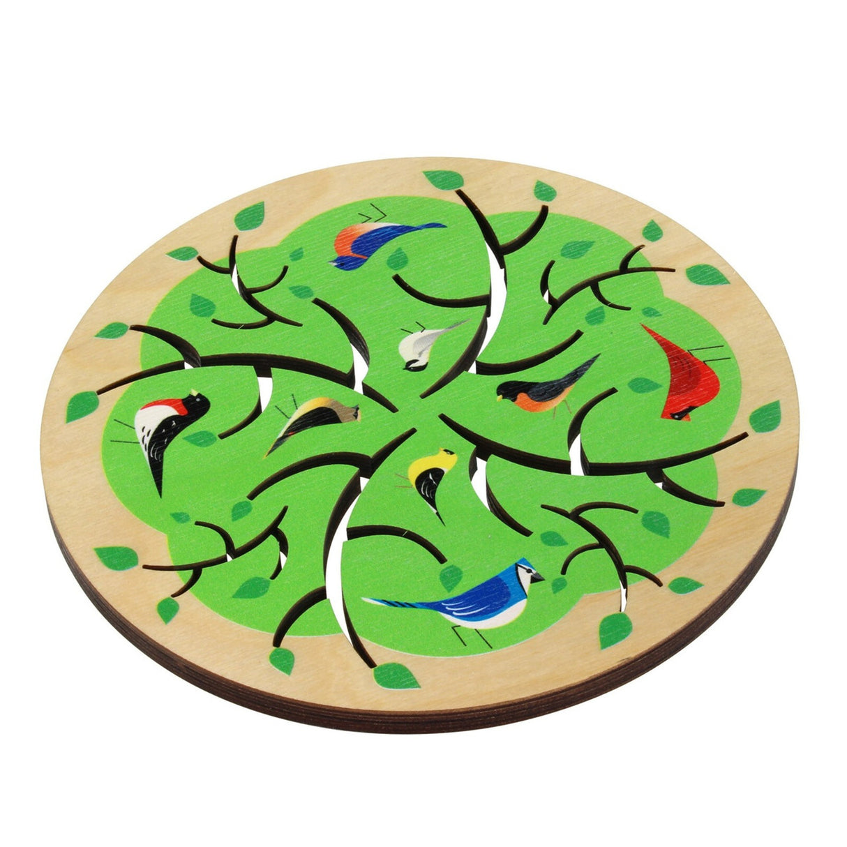 a round trivet made of light maple wood with laser cut tree branches radiating from the center and painted illustrations of various common birds