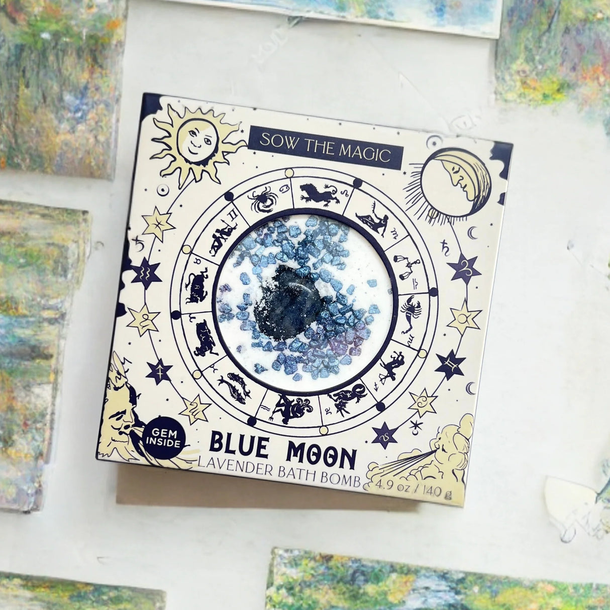 Blue Moon bath bomb packaging with astrological design on a white surface