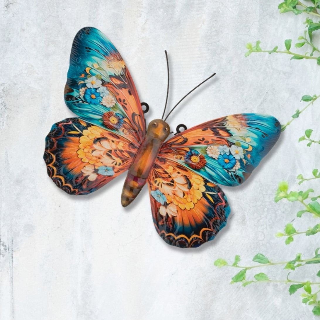 the butterfly decor installed on a white and gray wall with green vines