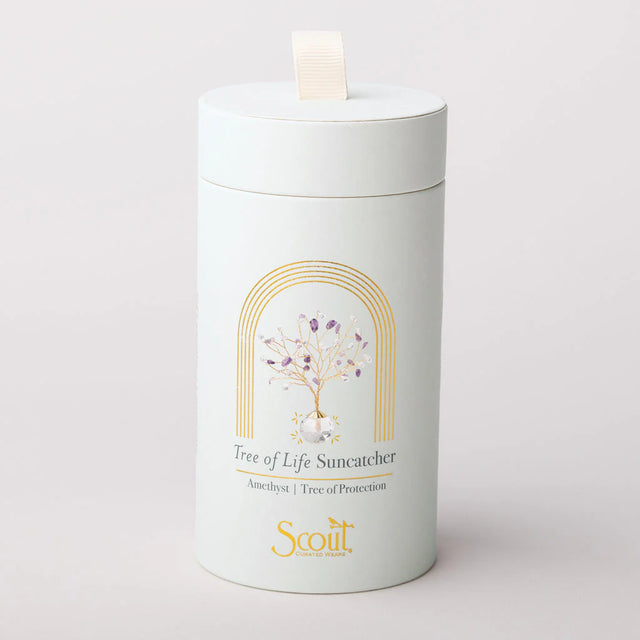 Cylindrical product packaging with 'Tree of Life Suncatcher' design on a light gray background