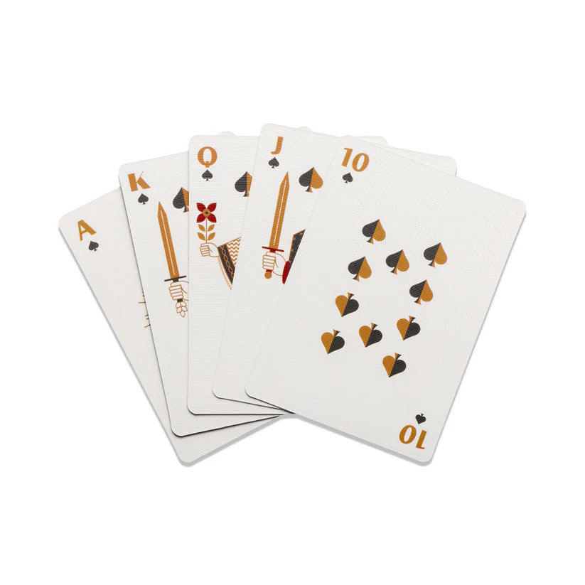 a selection of cards from the deck fanned on a white table showing the modern and minimal design