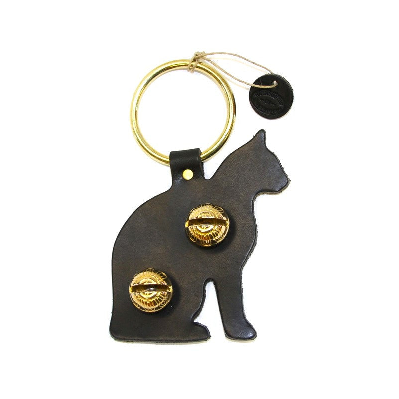 a door hanger bell in black leather stamped in the shape of a sitting cat in profile - includes 2 brass bells in the body and a brass loop for hanging on a door