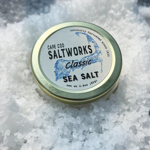 a jar of classic sea salt nestled in a layer of fresh salt