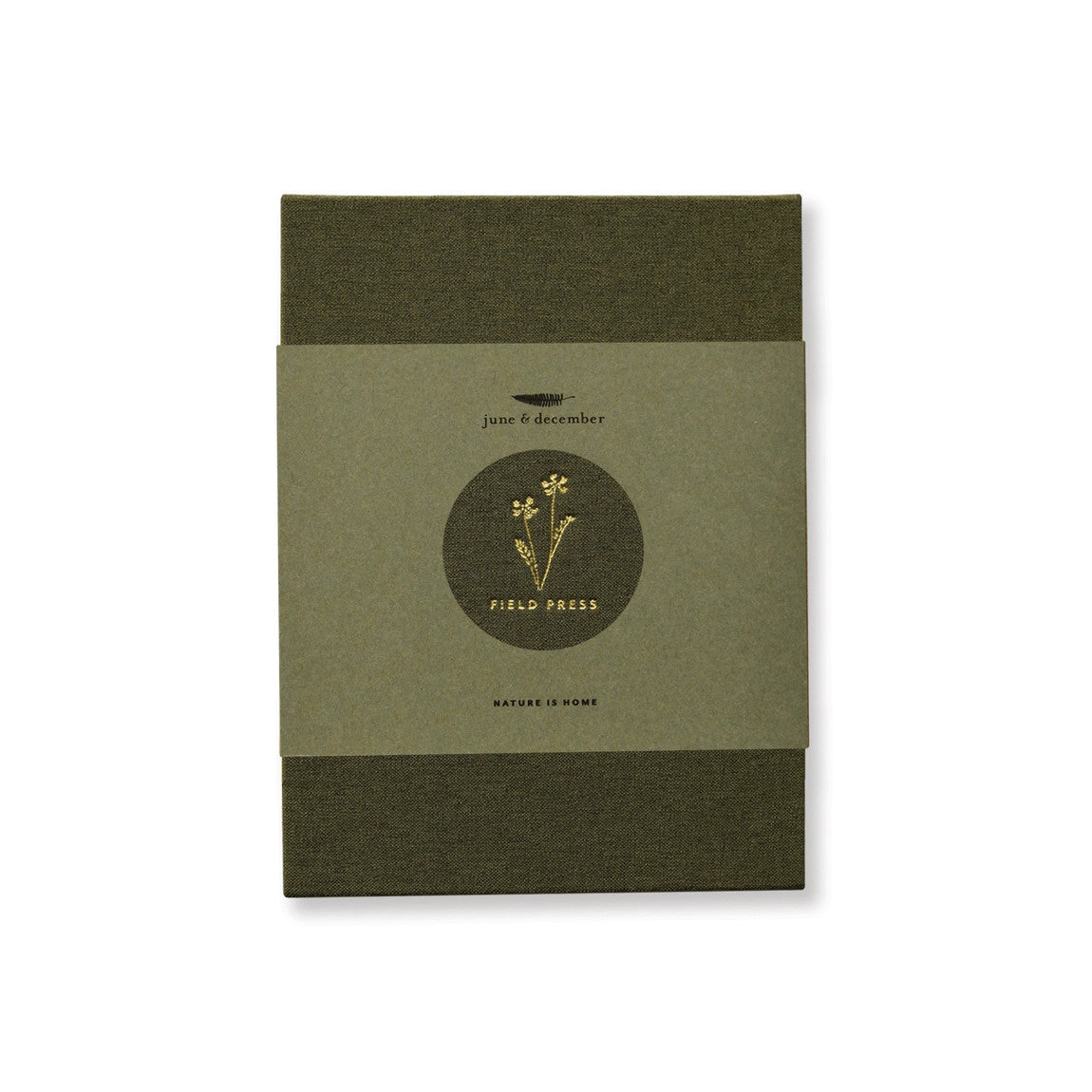 the field press with green linen cover and gold foil floral detail, comes in a hemp paper wrap