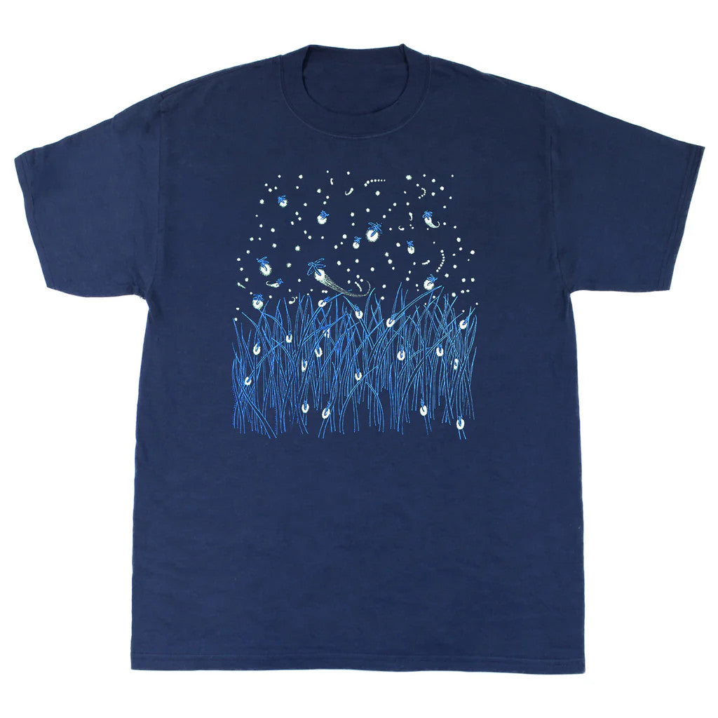 a navy blue tee shirt with illustration of a grassy field with fireflies and stars dotting the landscape