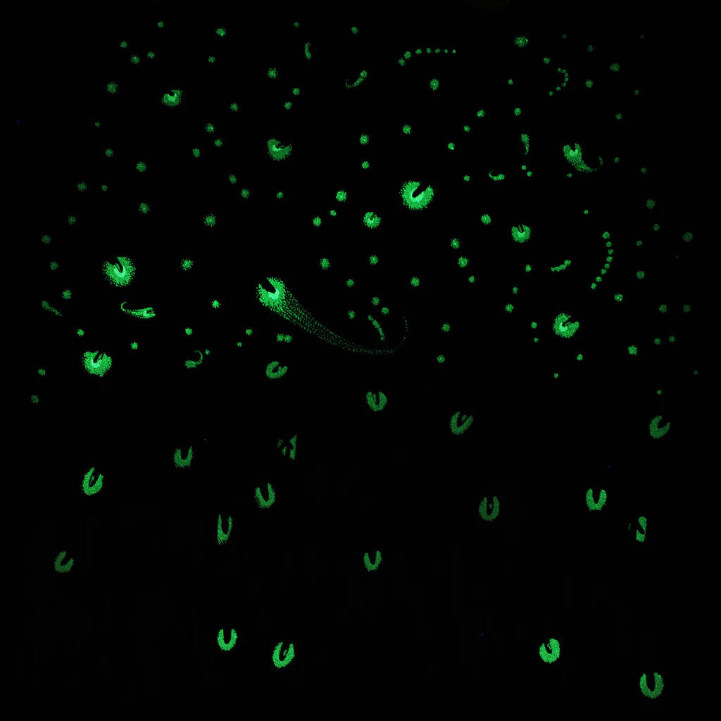 close up of the firefly tee in the dark showing how the fireflies glow in the dark