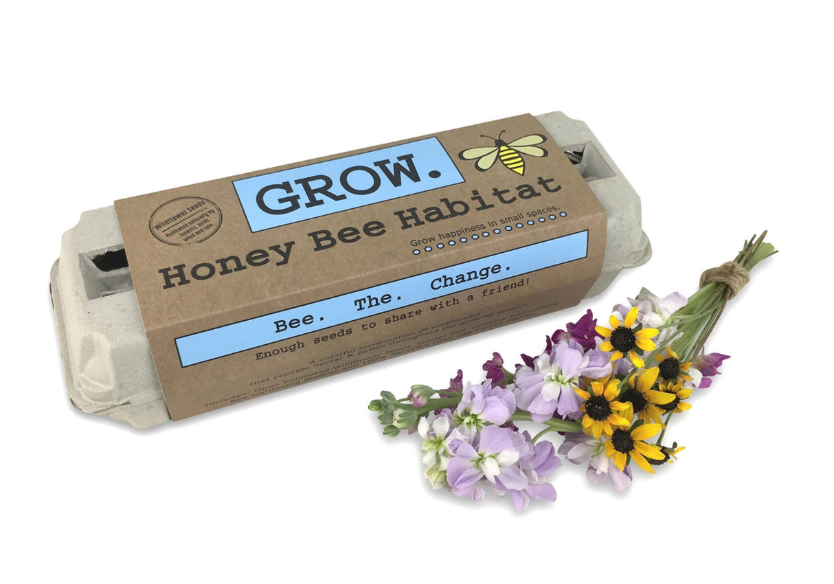 The Grow Honey Bee Habitat package alongside a bouquet of fresh cut flowers that bees love