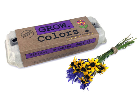 The Grow Colors garden kit in package alongside fresh cut flowers
