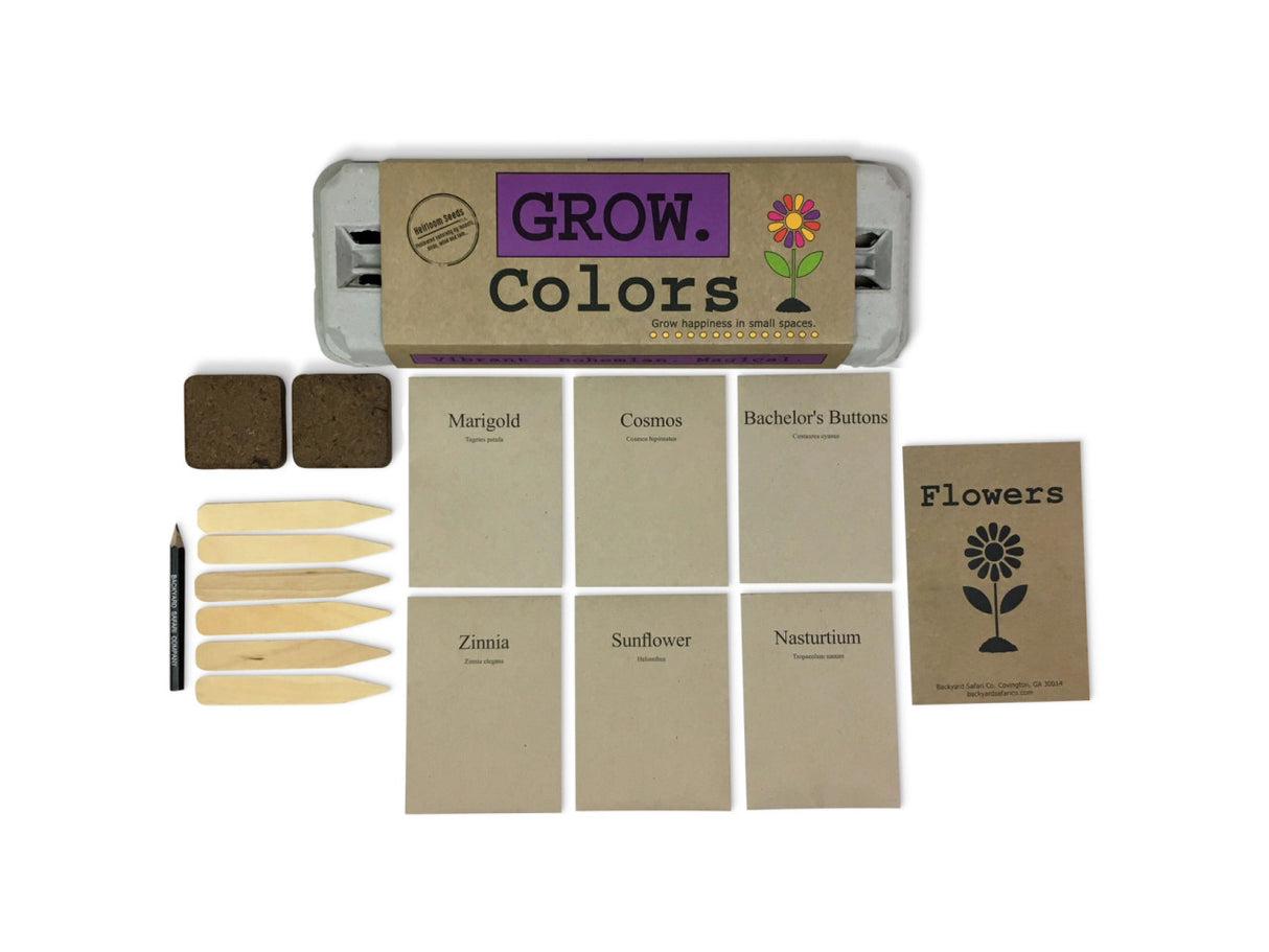 the package and contents of the grow colors garden kit: seeds, starter soil, wooden plant ID sticks, pencil, growing instructions