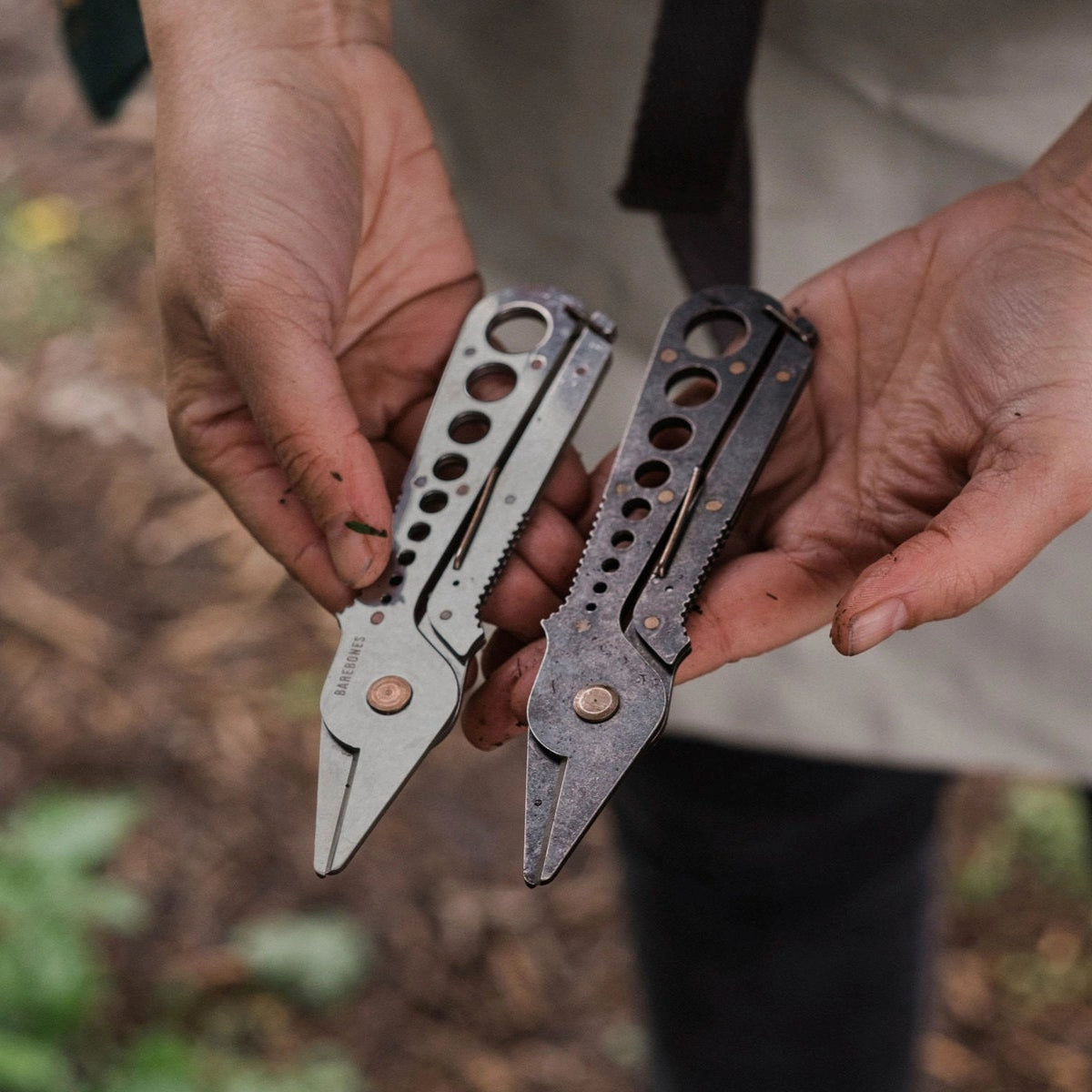 Both colors of the Herb Stripper, silver on the left, black on the right