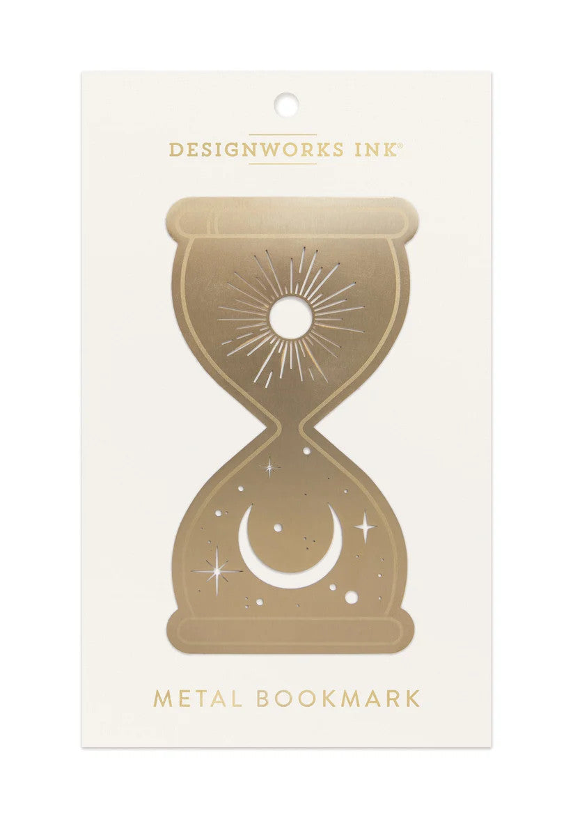 brass bookmark is die-cut into the shape of an hourglass, featuring a radiant sun with flowing rays at the top and a crescent moon surrounded by twinkling stars at the bottom