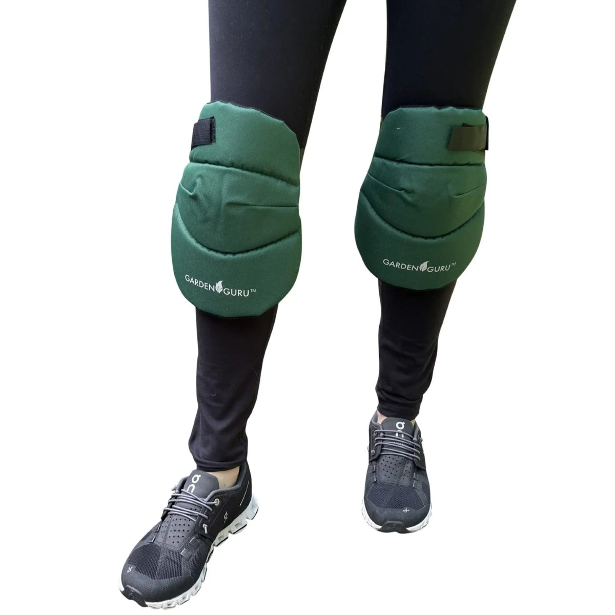 Green knee pads with 'Garden Guru' branding worn by a person on a white background