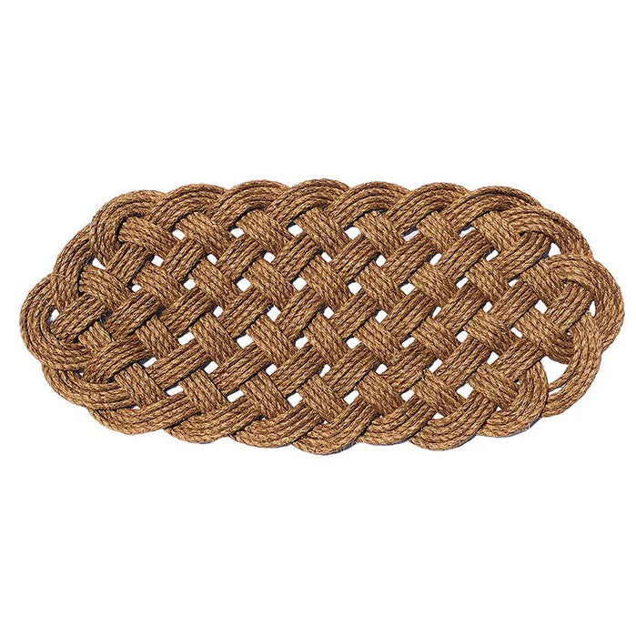 a large manila rope doormat with an intricate hand woven pattern