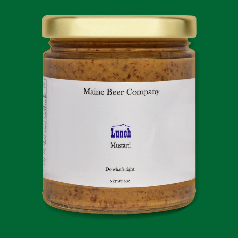 a jar of Maine Beer company Lunch Mustard in glass jar with gold lid