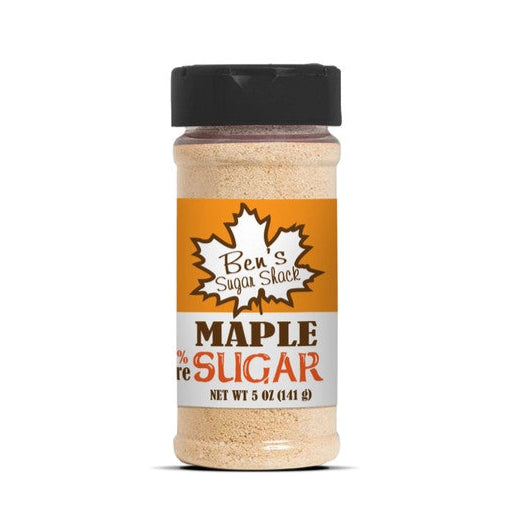 a cylindrical spice bottle with light brown contents and a label that reads "Ben's Sugar Shack Maple Sugar 5oz"