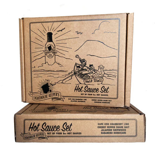 the hot sauce gift set box showing a sea scene with people in a rowboat headed toward a bottle of hot sauce on the horizon that shines like a lighthouse