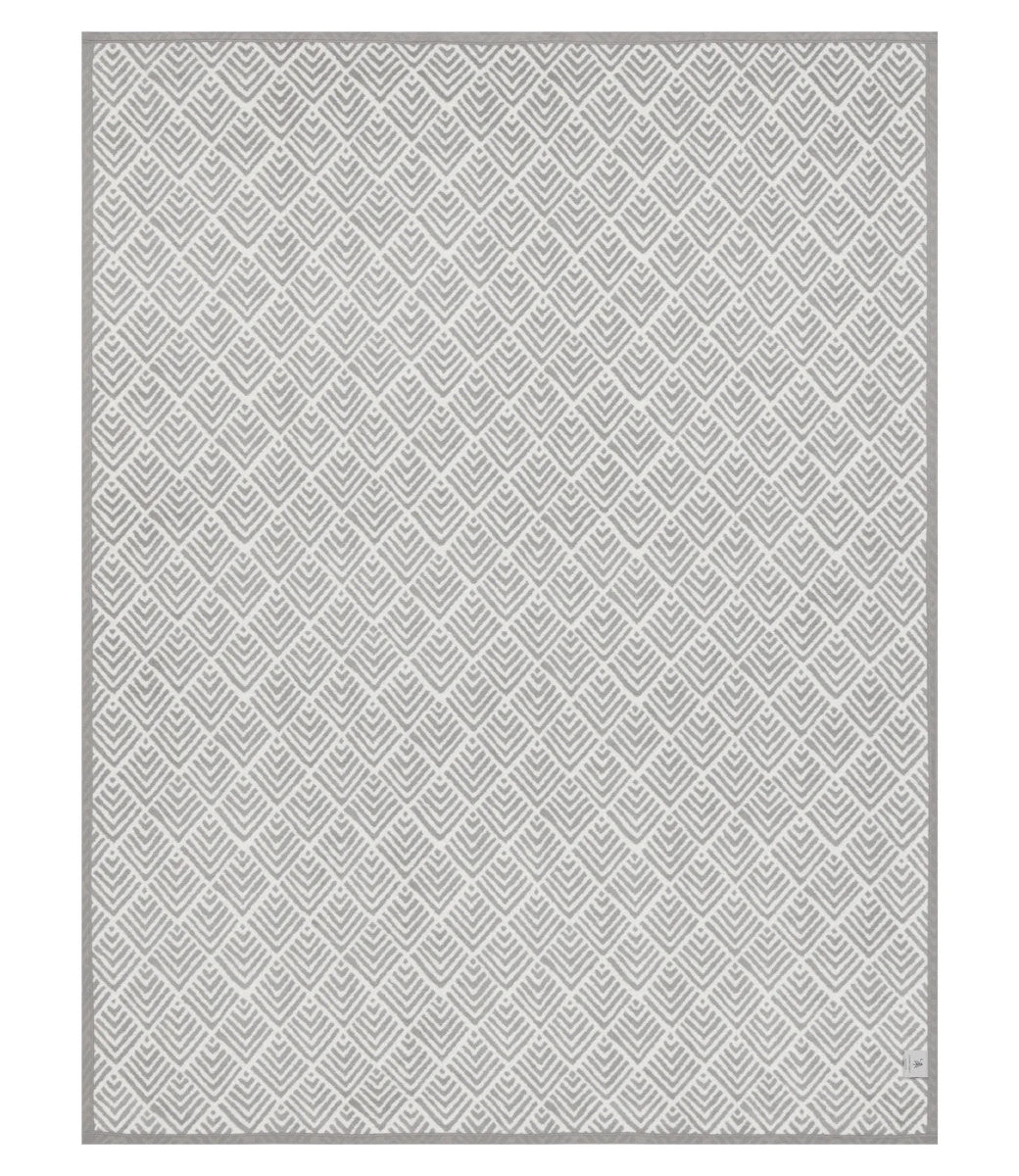 The front of the Oyster Cove Diamonds Grey blanket showing the full size and white and grey color scheme