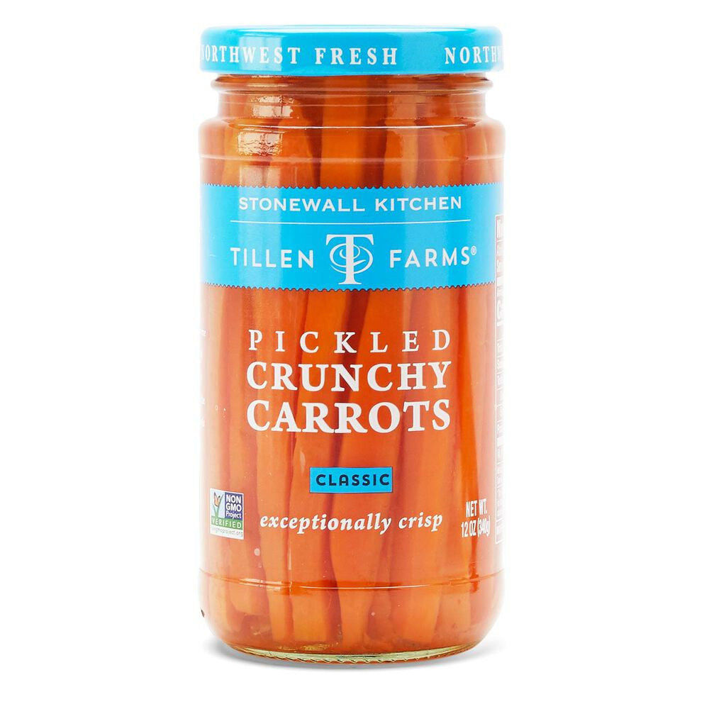 a tall narrow jar of bright orange pickled carrots with a sky blue lid