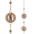 a close up of the water wheel on the rain chain alongside a section of the rain chain showing the detail of the water wheel