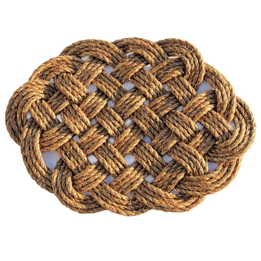 a hand woven rounded nautical door mat with intricate pattern on a white background