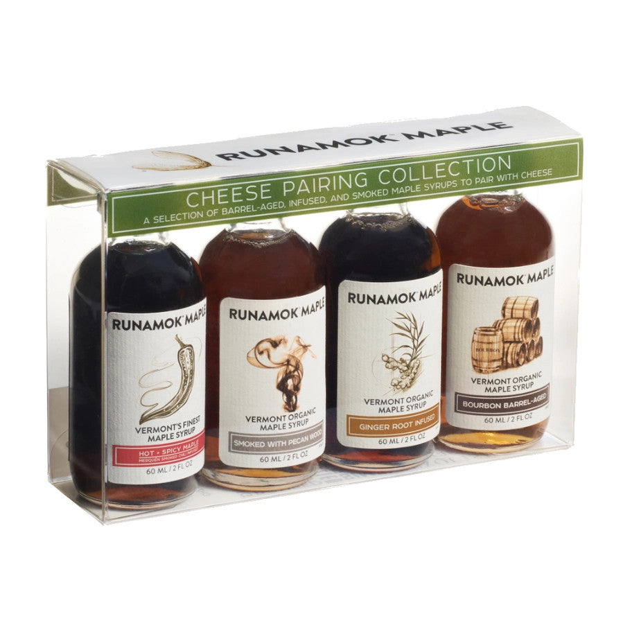 a clear gift package of 4 small bottles of maple syrup that pair well with cheese