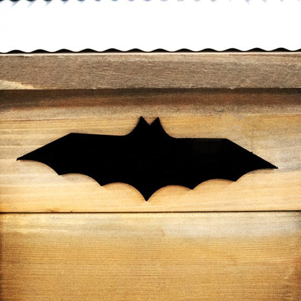 a close up of the black bat emblem on the Rustic Farmhouse Bat House
