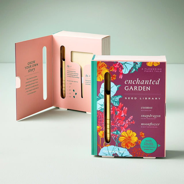 Enchanted Garden seed library packaging with floral design on a light gray background