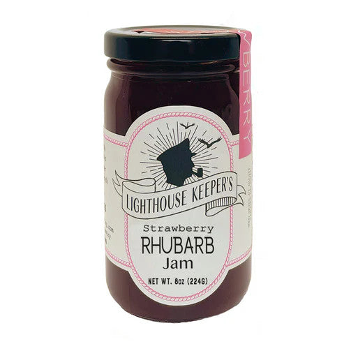 a jar of strawberry rhubarb jam with a white label with a logo of a silhoutted man in a captain's hat smoking a pipe with seagulls flying behind him