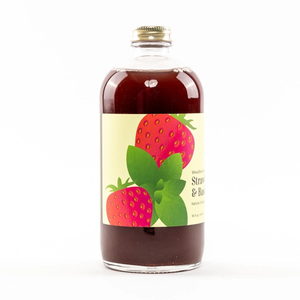 a side view of the Strawberry & Basil bottle showing the whole strawberry and basil illustration on the label