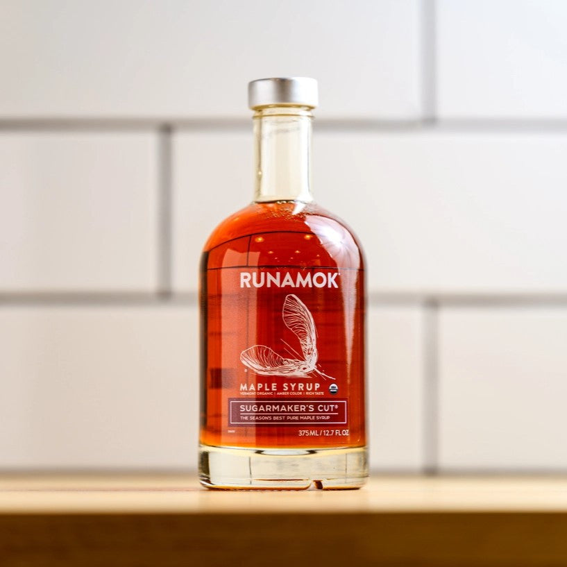 a bottle of Sugarmaker's Cut on a table with a white subway tile background