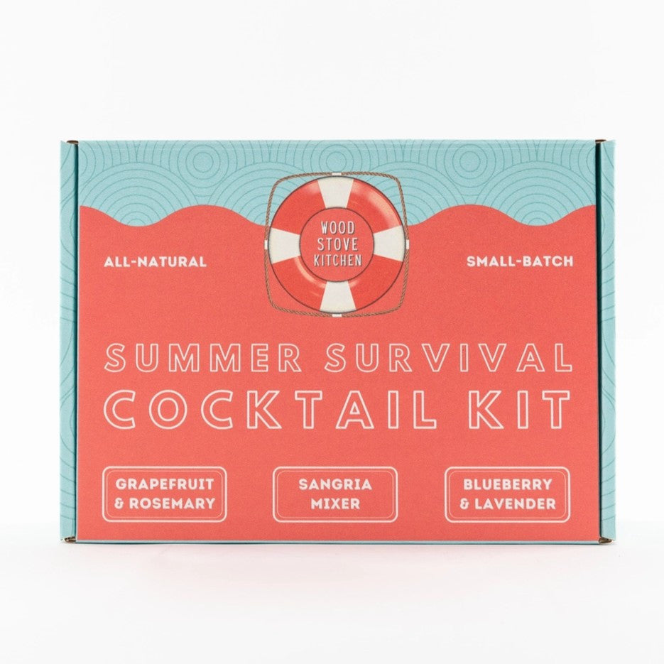 a close up of the graphics on the summer survival cocktail kit box with pale blue and coral colored graphics and life preserver logo