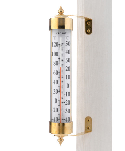 a close up of  A Brass and reliable thermostat telling you the degrees and celsius of that day.