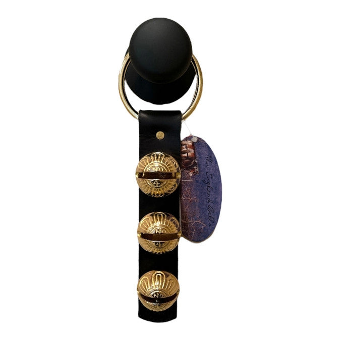 3 brass bells on a black leather strap - 10" in length