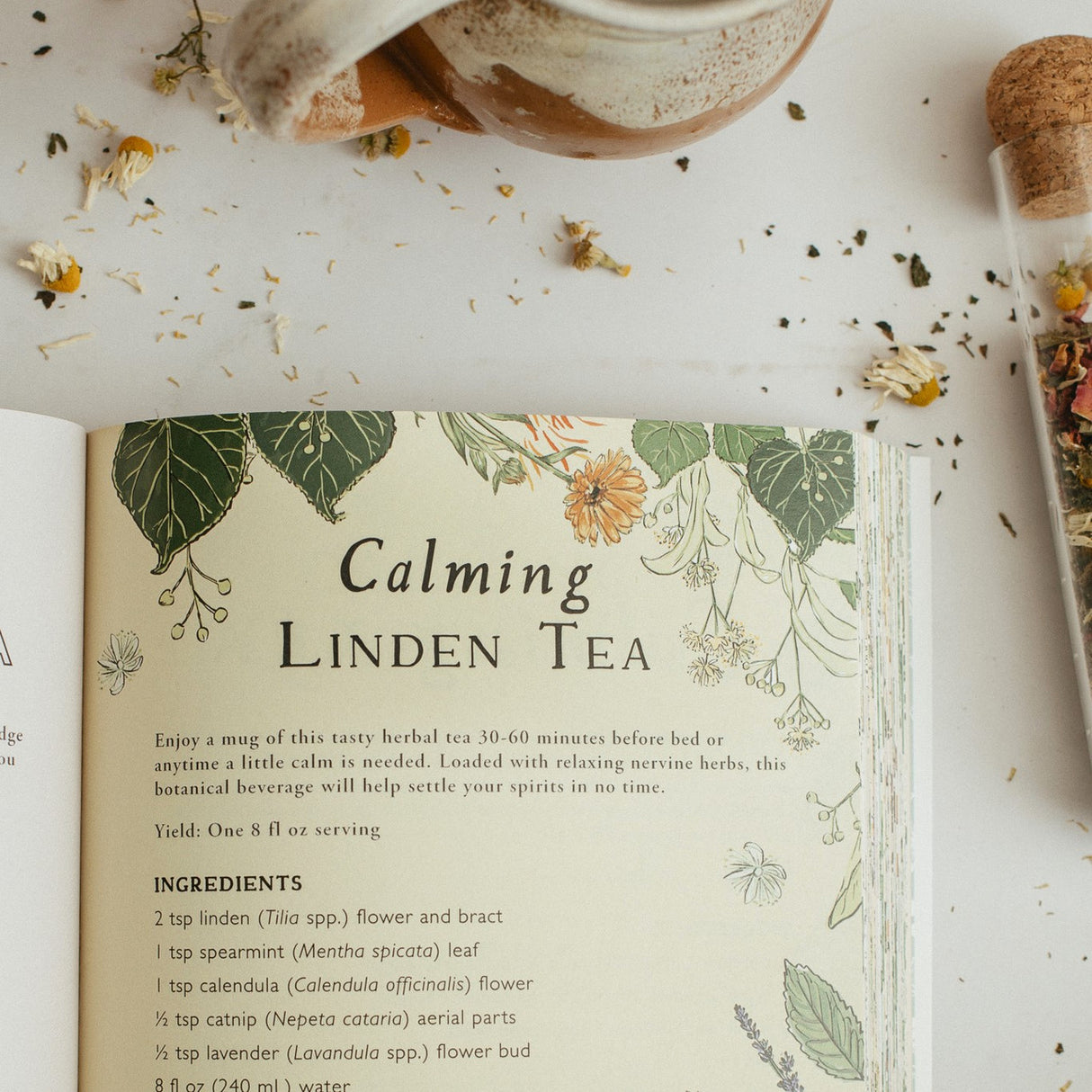 interior page of the botanical teas book open to the "Calming Linden Tea" recipe page