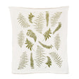 an off white tea towel with illustrations of green fern fronds