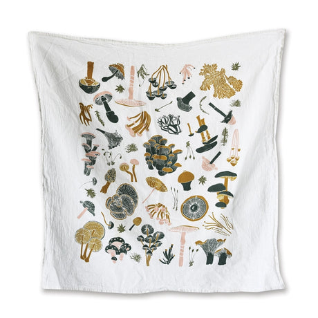 a white tea towel with playful illustrations of a variety of mushrooms